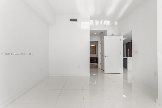 spare room with light tile patterned floors