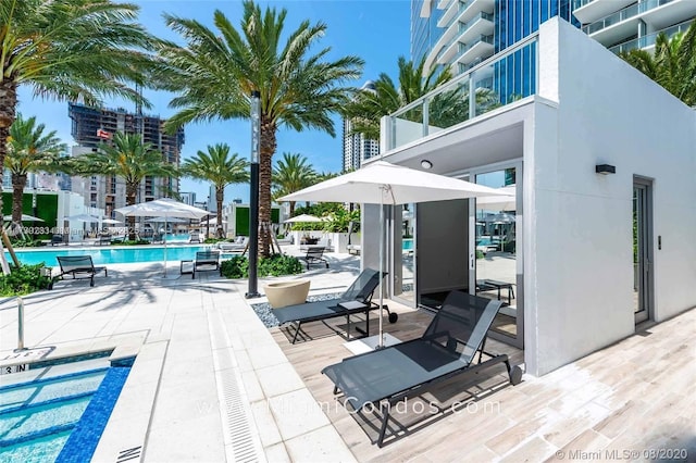 view of patio featuring a community pool