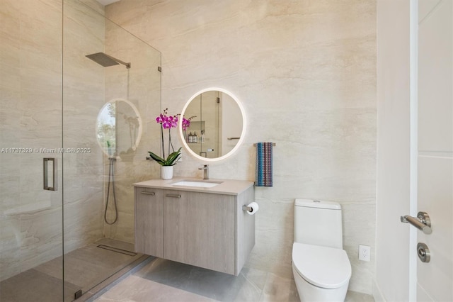 bathroom featuring vanity, tile walls, an enclosed shower, and toilet