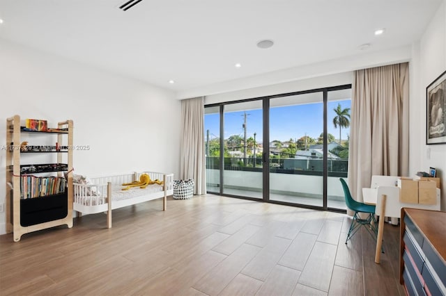 living area with light hardwood / wood-style flooring