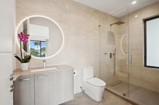 bathroom featuring tile walls, vanity, walk in shower, toilet, and tile patterned floors