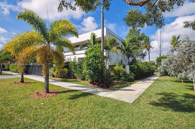 view of community featuring a lawn