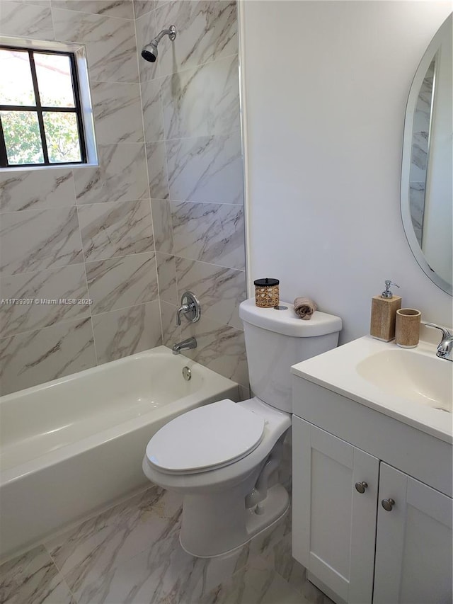 full bathroom with tiled shower / bath combo, vanity, and toilet