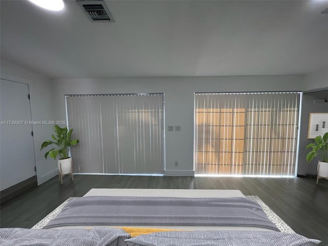 bedroom featuring dark hardwood / wood-style floors