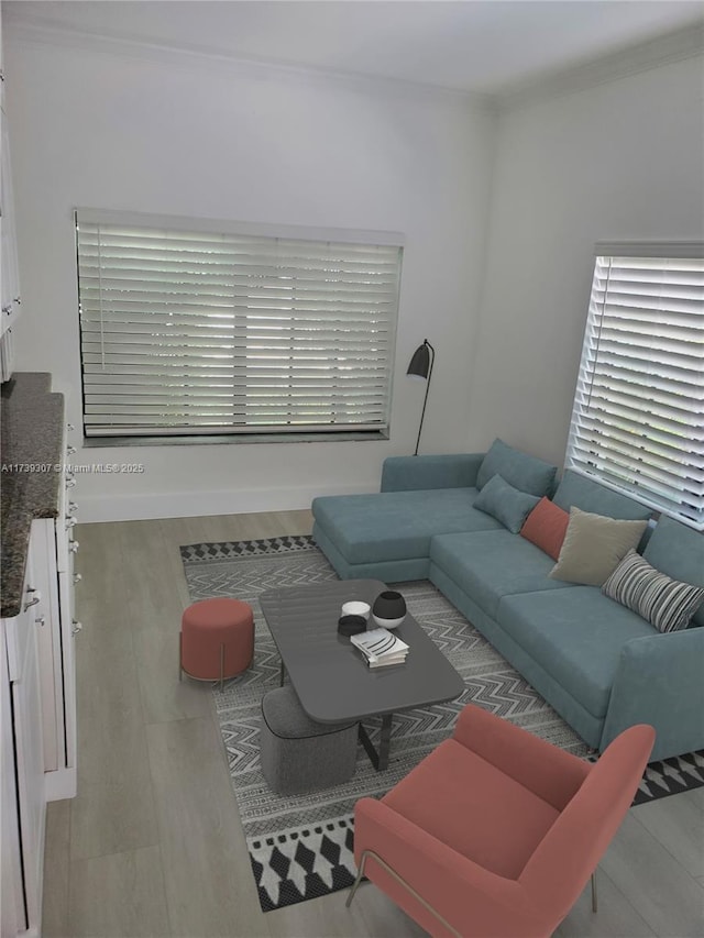 living room with ornamental molding and light wood-type flooring