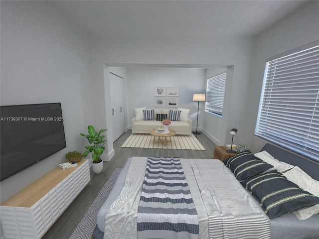 bedroom with dark wood-type flooring