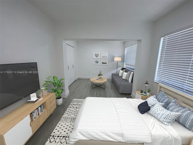 bedroom with dark wood-type flooring