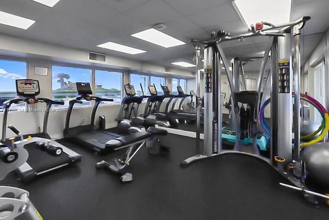 workout area with a paneled ceiling