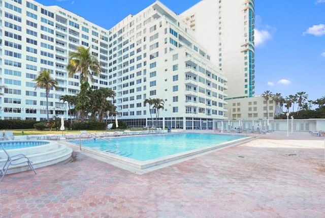 view of pool featuring a patio