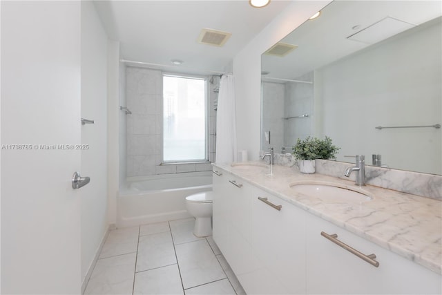 full bathroom featuring tile patterned flooring, vanity, shower / bath combo, and toilet