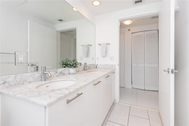 bathroom featuring vanity and tile patterned flooring