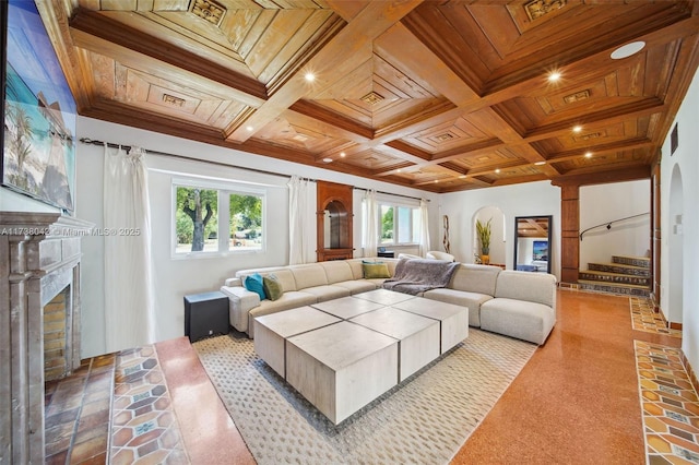 living area featuring a brick fireplace, wood ceiling, coffered ceiling, and plenty of natural light