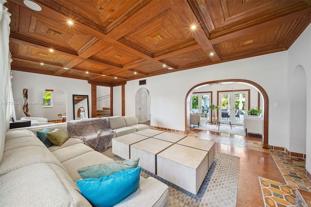 living area featuring arched walkways, wooden ceiling, coffered ceiling, baseboards, and french doors