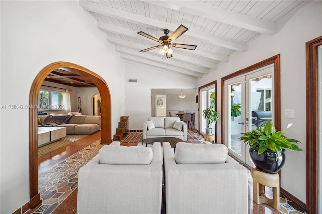 living room with visible vents, arched walkways, lofted ceiling with beams, wood ceiling, and french doors