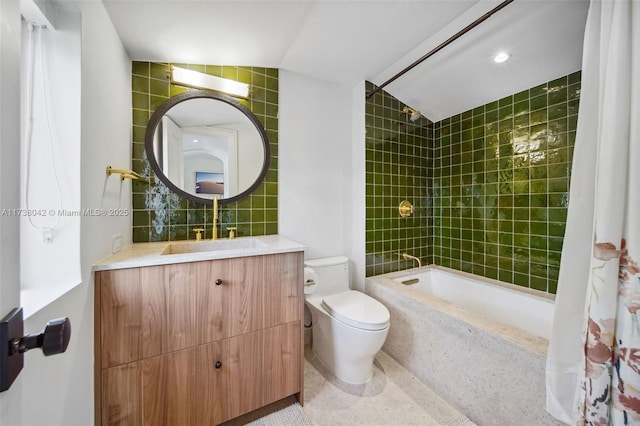 bathroom featuring shower / tub combo, vanity, and toilet