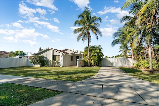 single story home featuring a front yard