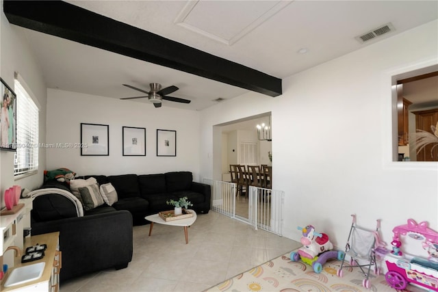 living room featuring ceiling fan, light tile patterned floors, and beam ceiling