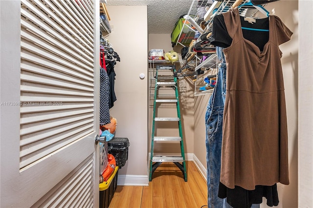 walk in closet featuring wood-type flooring