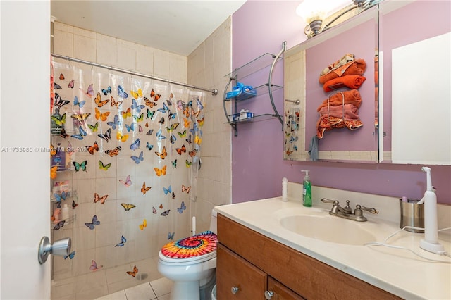 bathroom with vanity, tile patterned flooring, curtained shower, and toilet