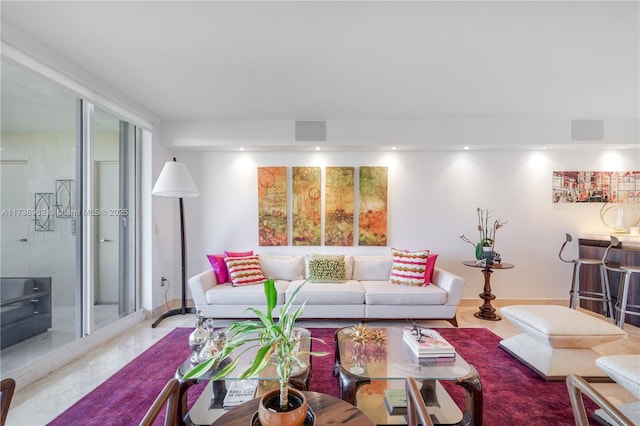 living area with visible vents and recessed lighting