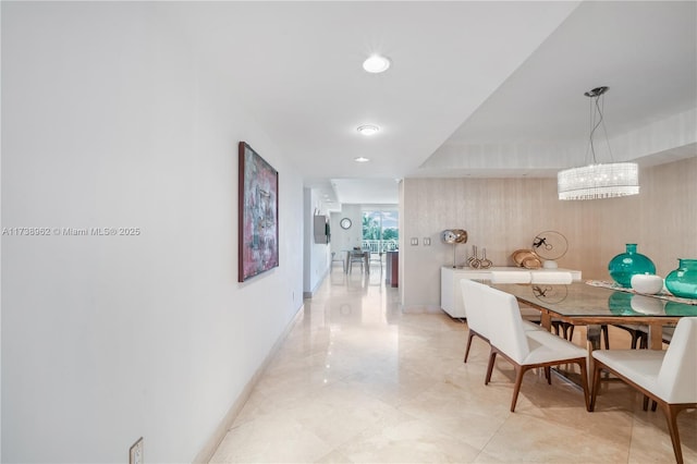 hall featuring recessed lighting and baseboards