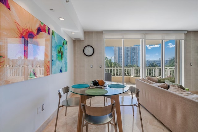 dining room with tile patterned flooring, a view of city, and recessed lighting