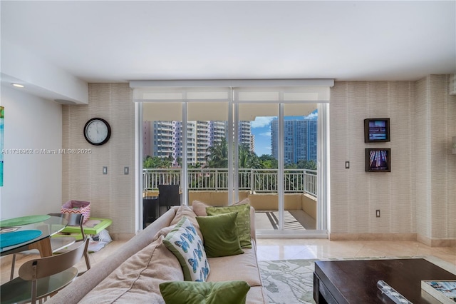 living area with a city view and tile patterned floors