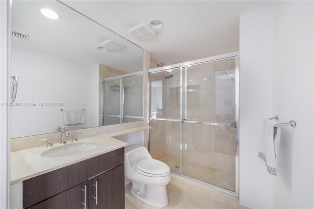 full bathroom with vanity, toilet, visible vents, and a stall shower