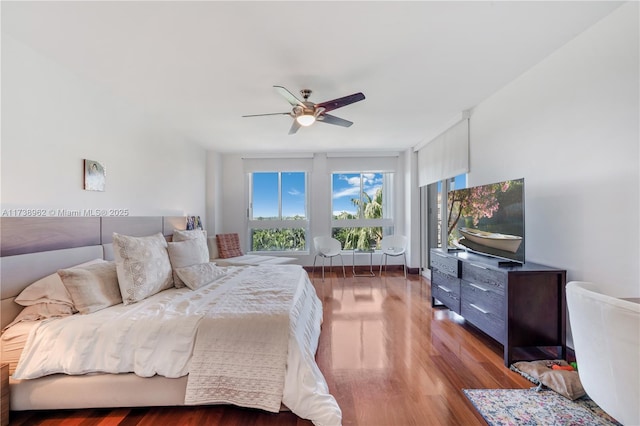 bedroom with wood finished floors and a ceiling fan