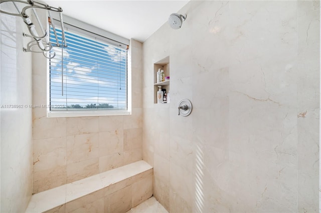 full bath featuring tiled shower