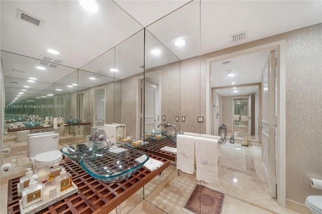 bathroom featuring visible vents, recessed lighting, toilet, and radiator heating unit