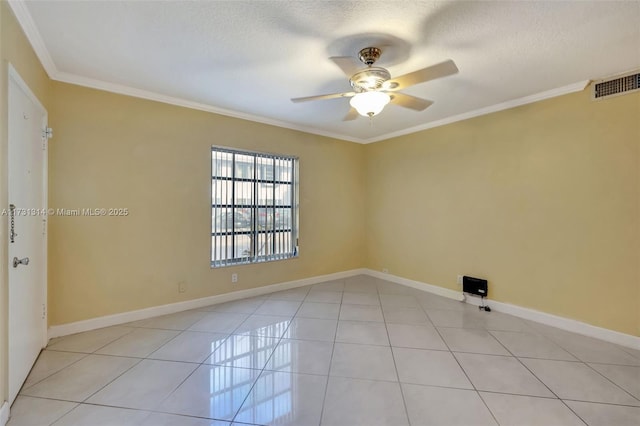 spare room featuring light tile patterned floors, a textured ceiling, ornamental molding, and ceiling fan