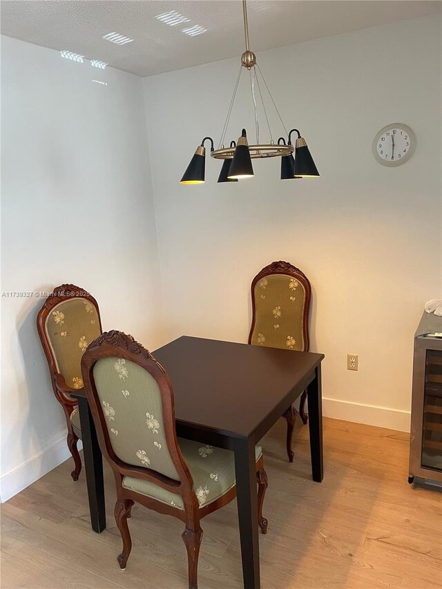 dining space with light hardwood / wood-style floors