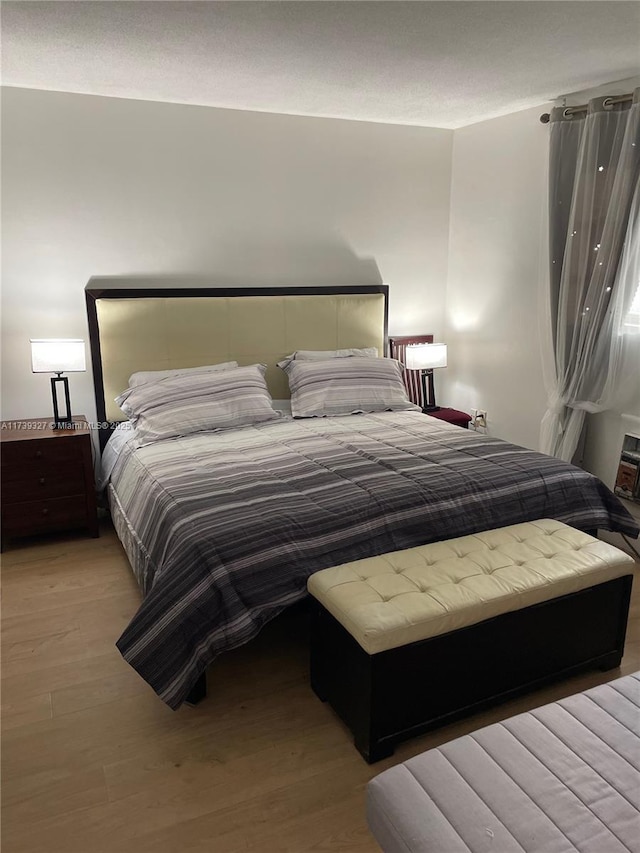 bedroom with light wood-type flooring