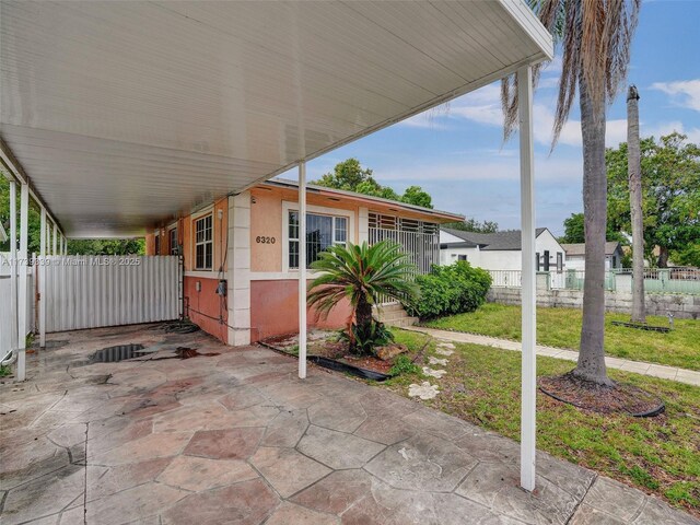 view of patio featuring a carport