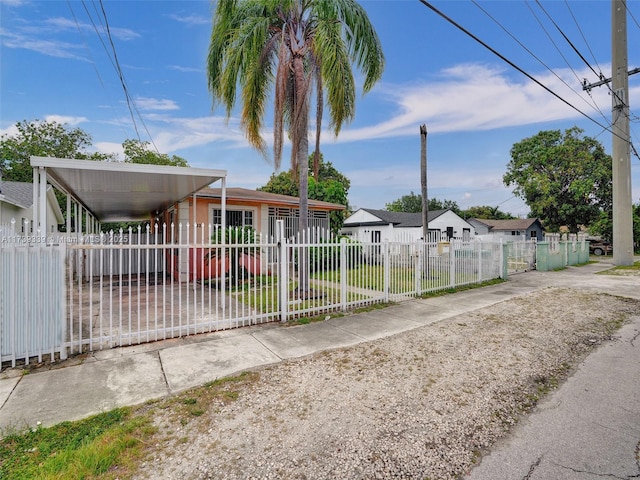 view of front of property featuring a carport