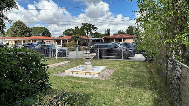 view of yard featuring a gate and fence