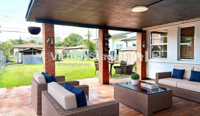 view of patio / terrace with outdoor lounge area and fence