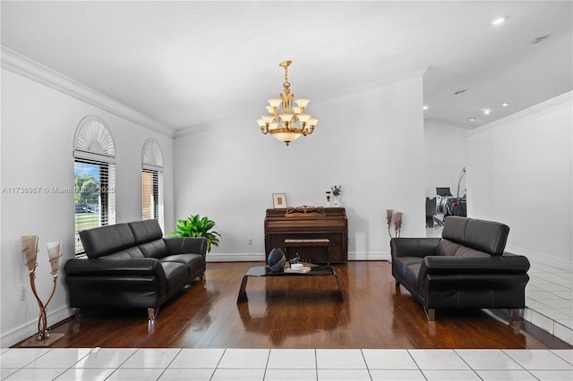 living area with baseboards and ornamental molding