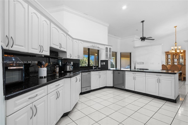 kitchen with a peninsula, a sink, white cabinetry, stainless steel dishwasher, and ornamental molding