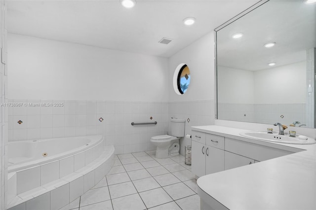 full bath with visible vents, toilet, vanity, tile patterned flooring, and a whirlpool tub