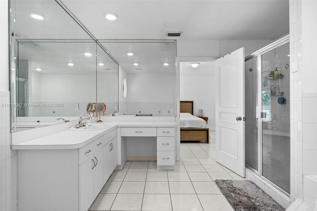 bathroom with visible vents, ensuite bathroom, a shower stall, vanity, and tile patterned floors