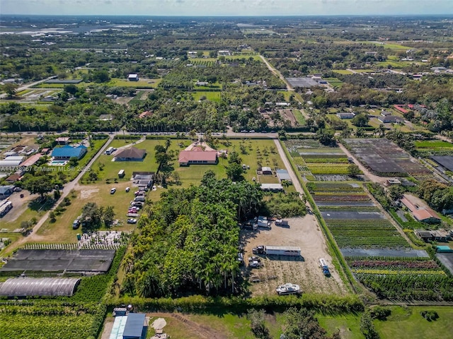 birds eye view of property with a rural view