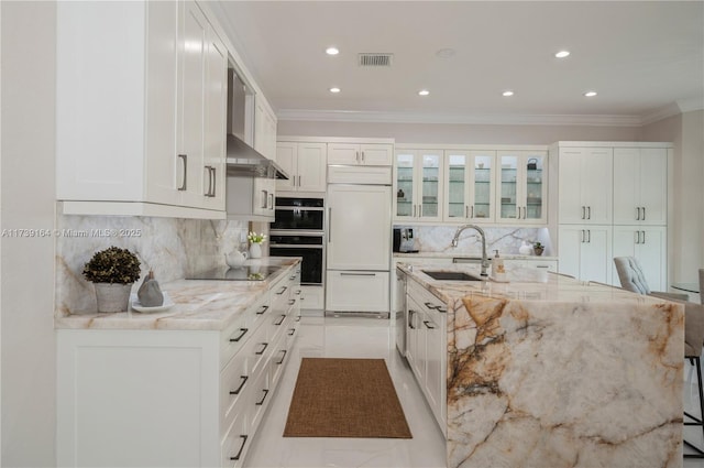 kitchen featuring white cabinetry, sink, black appliances, and light stone countertops