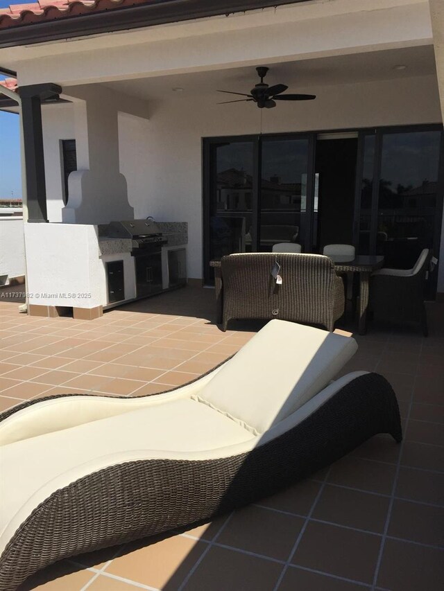 view of patio / terrace featuring ceiling fan and a grill