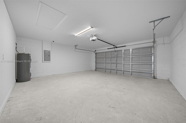 garage featuring a garage door opener, electric panel, and electric water heater