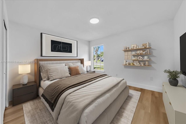 bedroom with light hardwood / wood-style flooring