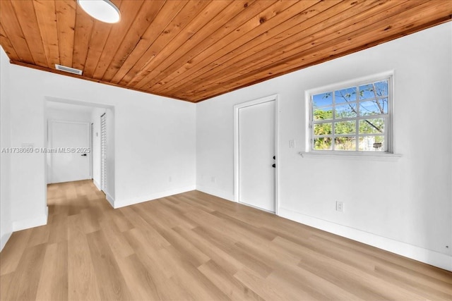 interior space featuring ornamental molding, wooden ceiling, and light hardwood / wood-style floors