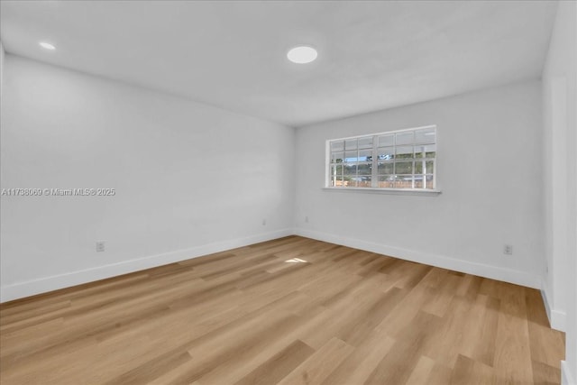 unfurnished room featuring light hardwood / wood-style flooring