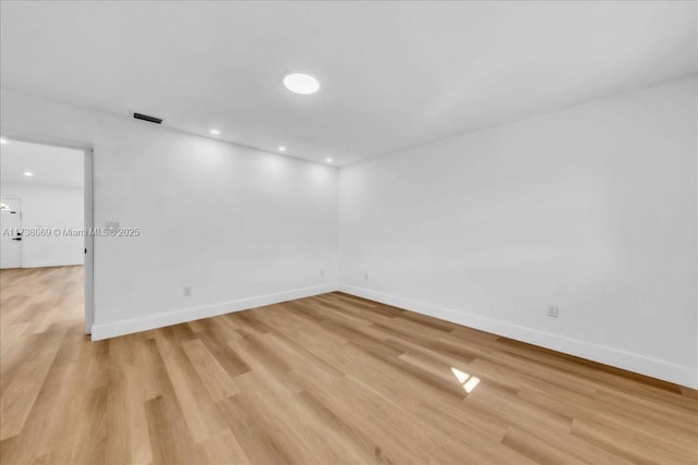 empty room with light wood-type flooring